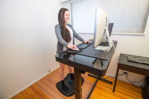 woman working at an ergonomic desk
